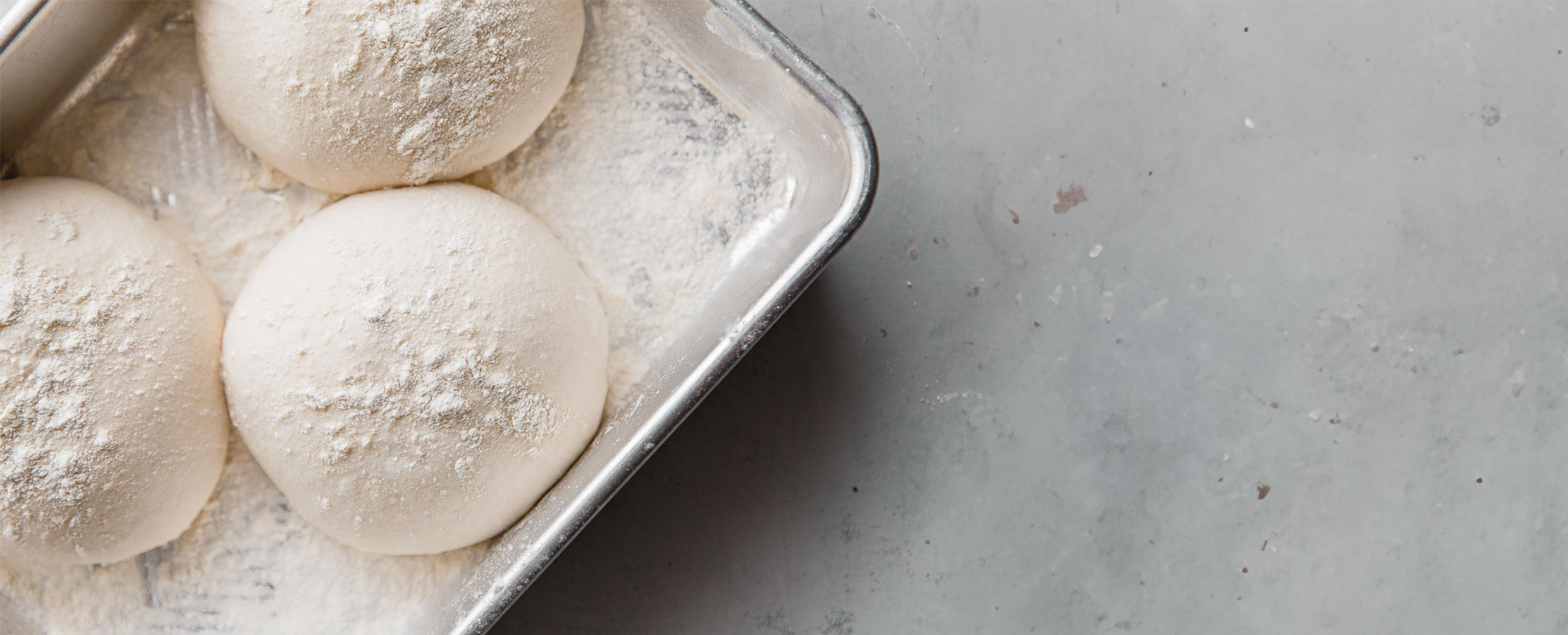 Letizza snap frozen dough balls on a tray